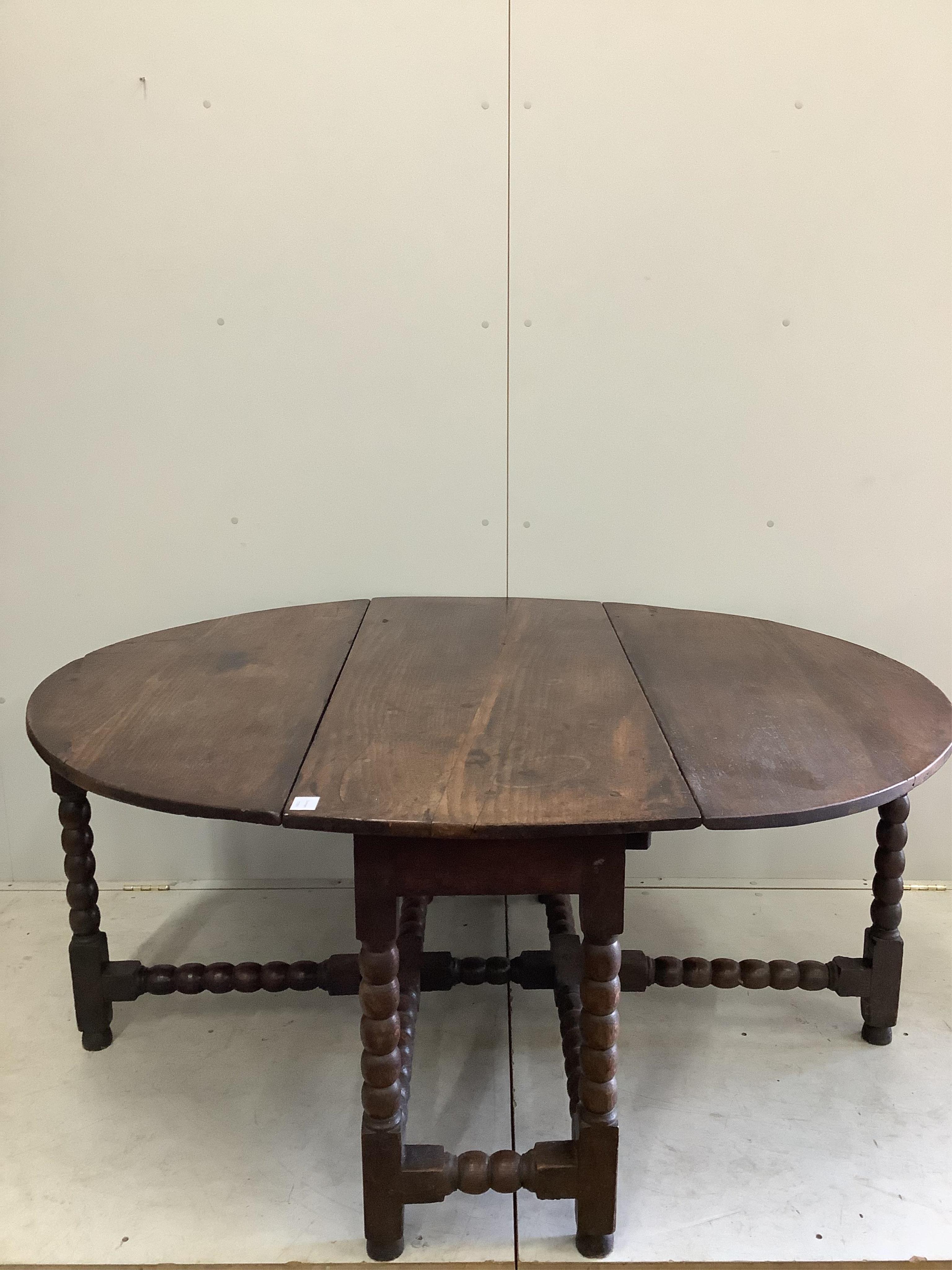 An 18th century oak gateleg table, width 122cm, depth 56cm, height 72cm. Condition - poor to fair
